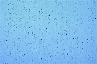 Rain water drops droplets on window glass texture background