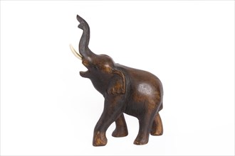 Wooden elephant figurine from Thailand isolated on white background