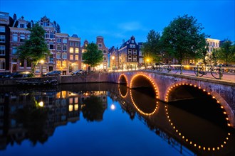 Night view of Amterdam cityscape with canal
