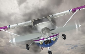 The cessna 172 with smoke coming from the engine against an ominous gray sky