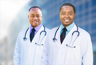 Handsome african american male doctors outside of hospital building