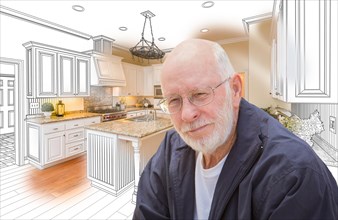 Happy senior man over custom kitchen design drawing and photo