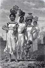 Women in Paraguay fetching water in clay jugs on their heads from the river in 1880