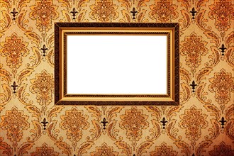 Vintage gold plated picture frame on retro wallpaper background
