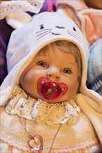 Portrait of an old decorative baby doll