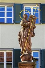 Figure of the Virgin Mary with baby Jesus and wreath of stars