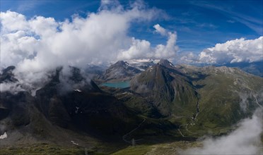 Aerial view high above the Nufenen Pass in the Swiss mountains with Lake Griessee