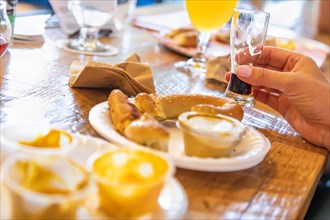 Woman enjoys warm pretzels and micro brew beer