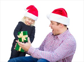 Happy young girl and father wearing santa hats opening gift box isolated on white
