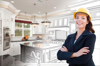 Smiling female contractor over kitchen drawing gradating to photo