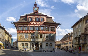 View of the town hall at the Rathausplatz with the old historic painted houses
