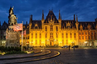 Famous belgian tourist destination Grote markt square and Provincial Court building and Jan Breydel and Pieter de Coninck Monument in Bruges