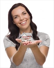 mixed-race woman holding small house isolated on white background