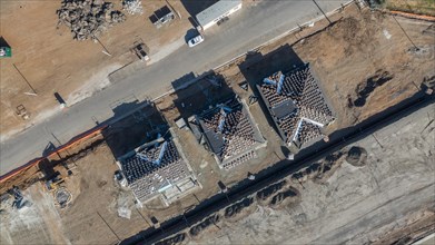 Drone aerial view of home construction site early stage