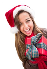 Girl wearing A christmas santa hat with bow wrapped gift iisolated on white