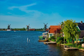 Netherlands rural lanscape Windmills at famous tourist site Zaanse Schans in Holland Zaandam