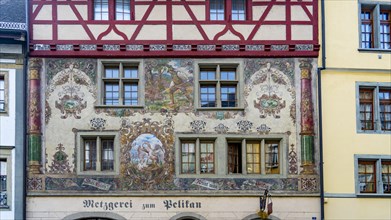 Detail of house facades on the town hall square with old historic painted houses