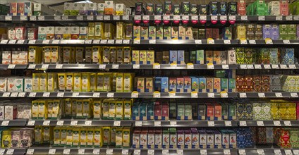 Shelves with different types of tea bags in an organic supermarket