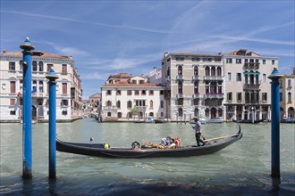 Gondola with tourists on the canal grande