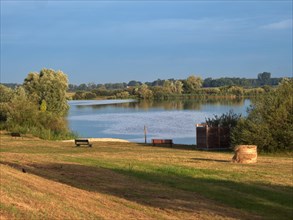 Meadow and bathing beach at Gartow Lake in the Elbe River Landscape UNESCO Biosphere Reserve. Gartow