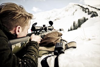 Hunter prepares to shoot. Mountain hunting Karwendel Mountains