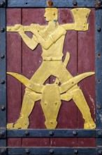 Historical figure on the door to the Ratskeller representing the trade of the butcher