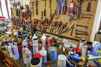 Tools and spray cans in a saddlery in Allgaeu