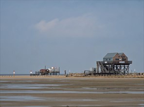 Beach and pile dwellings on the North Sea coast in St. Peter Ording