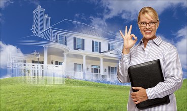 Businesswoman making okay hand sign with ghosted house drawing
