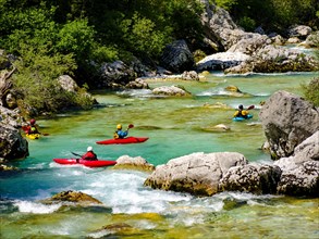 Kayakers on the emerald green Soca River