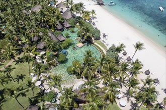 Aerial view The beach of Flic en Flac with luxury hotel and palm trees