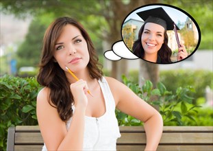 Thoughtful young woman with herself as a graduate inside thought bubble