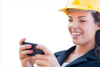 Female contractor in hard hat using smart phone isolated on white