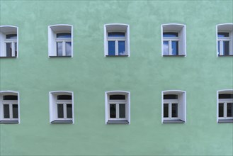 Turquoise facade with windows