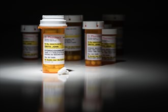 Hydrocodone pills and prescription bottles with non proprietary label. no model release required