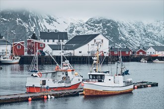 Pier with ships in Hamnoy fishing village on Lofoten Islands