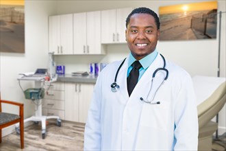 African american male doctor standing in office
