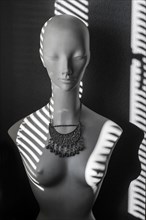 White fashion doll with oriental silver jewellery