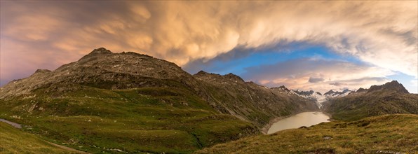 Stormy atmosphere over Lake Oberaar and the Bernese Alps