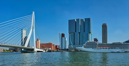Panorama of Rotterdam cityscape with cruise liner and Erasmus bridge. Netherlands