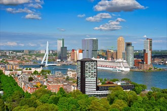 View of Rotterdam city and the Erasmus bridge Erasmusbrug over Nieuwe Maas river with cruise liner from Euromast
