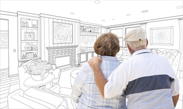 Curious senior couple looking over custom living room design drawing