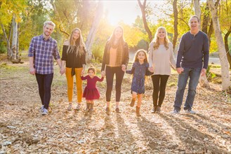 Multigenerational mixed-race family portrait outdoors