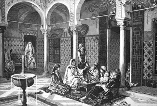 Women at the fortune teller in an Arabian house