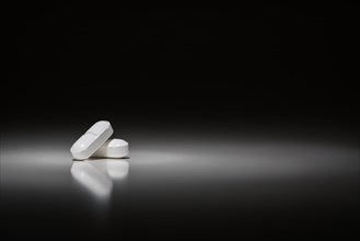 Hydrocodone prescription pills under spot light