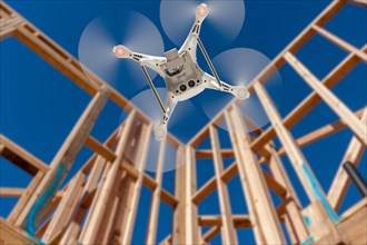 Drone quadcopter flying and inspecting construction site