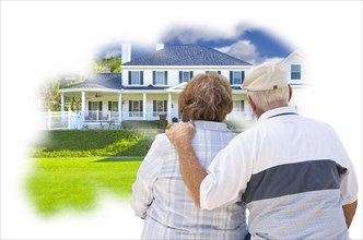 Daydreaming senior couple over custom home photo inside thought bubble