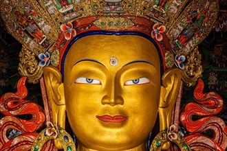 Maitreya Buddha statue face close up in Thiksey Gompa. Ladakh