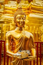 Gold Buddha statue in Wat Phra That Doi Suthep