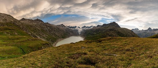 Stormy atmosphere over Lake Oberaar and the Bernese Alps